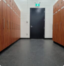 Hallway lined with wood-paneled lockers