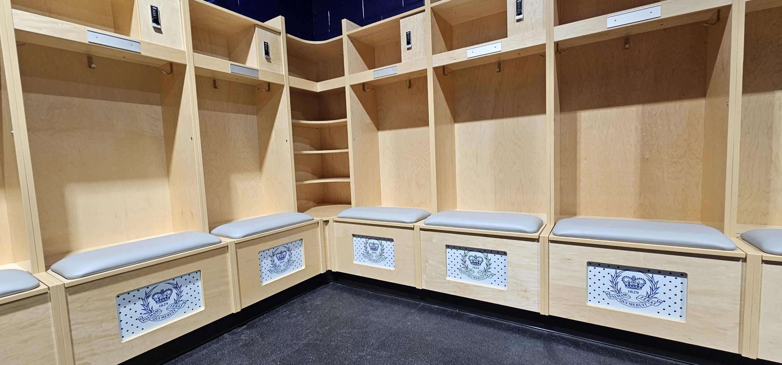 Football locker room with corner shelf