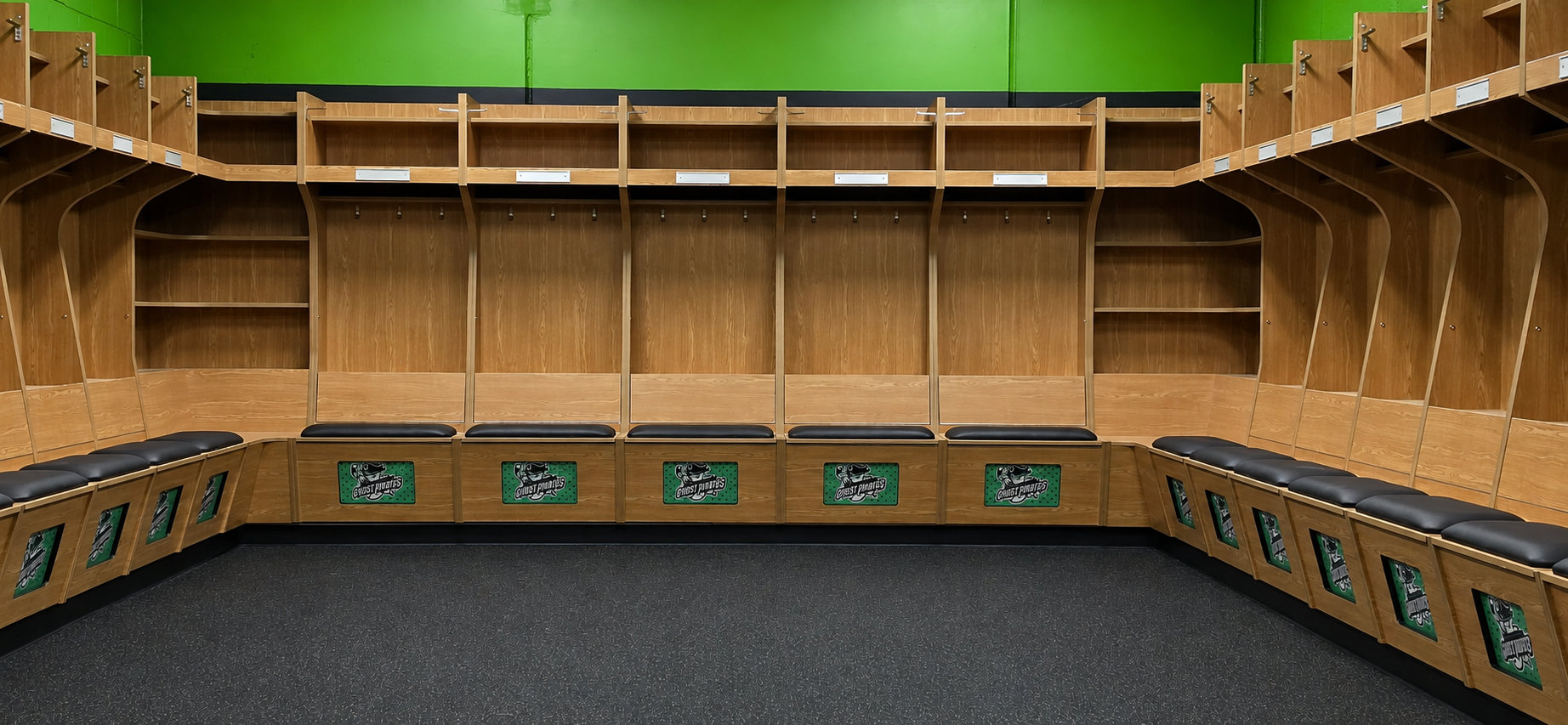 Photo of custom hockey locker room with two corner shelf for storage.